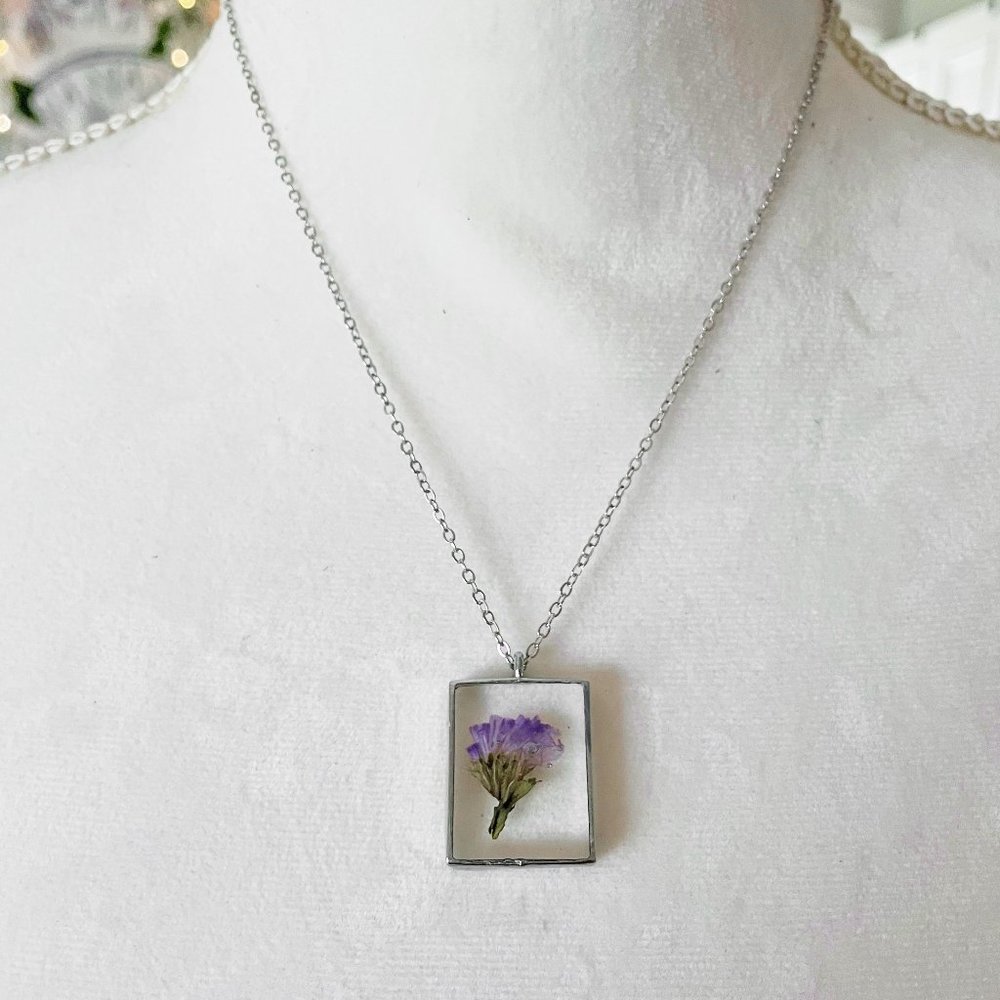 Purple floral botanical flower resin necklace in dark silver bezel